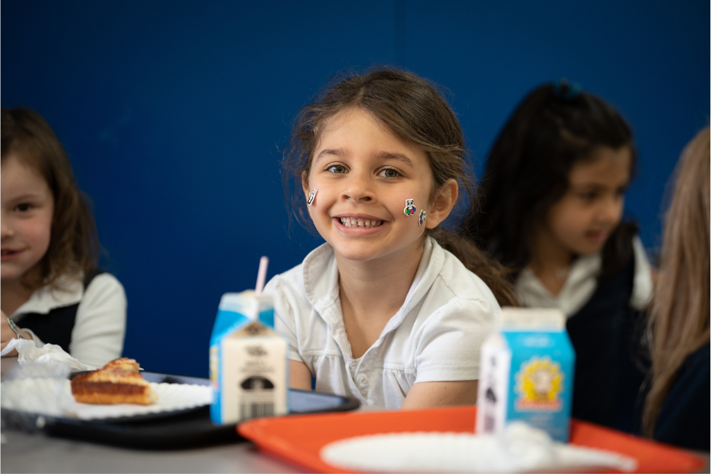 Girl sitting in lunchroom